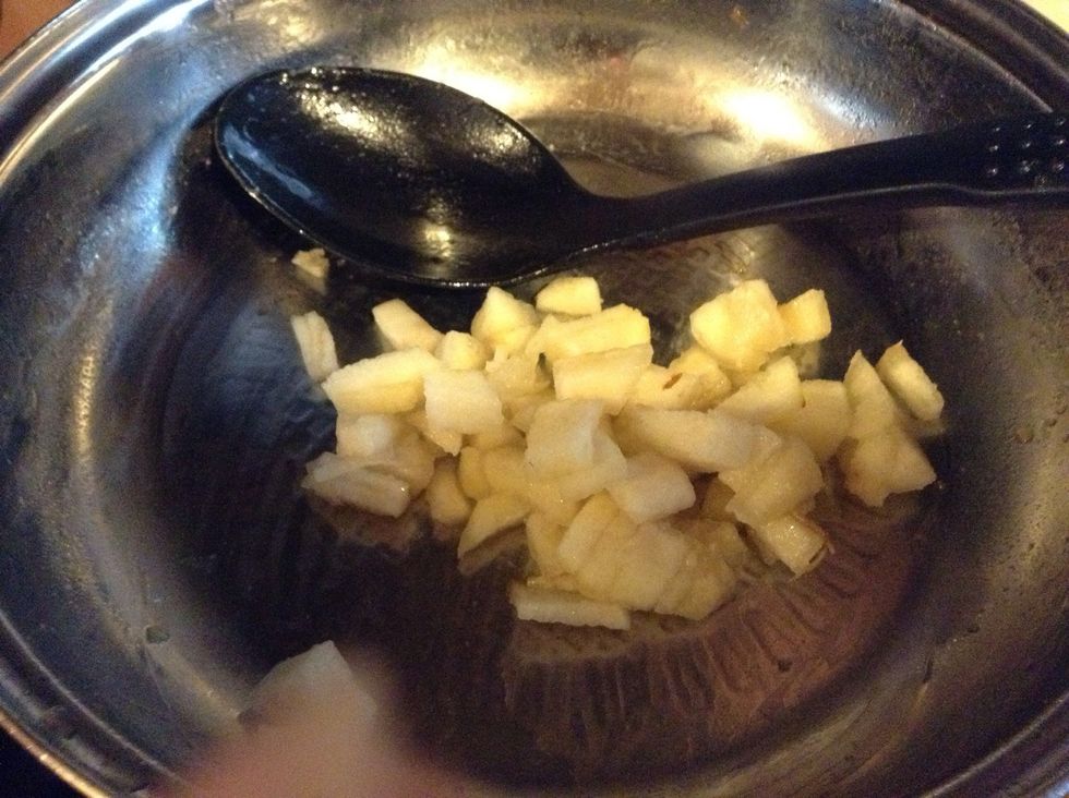 Add the pear, then add 5 table spoon sugar, when get golden and the pear is soft turn off