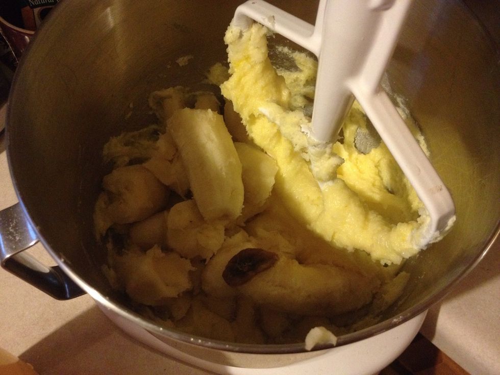 Add the peeled bananas. I break them up into pieces and the mix until well blended.