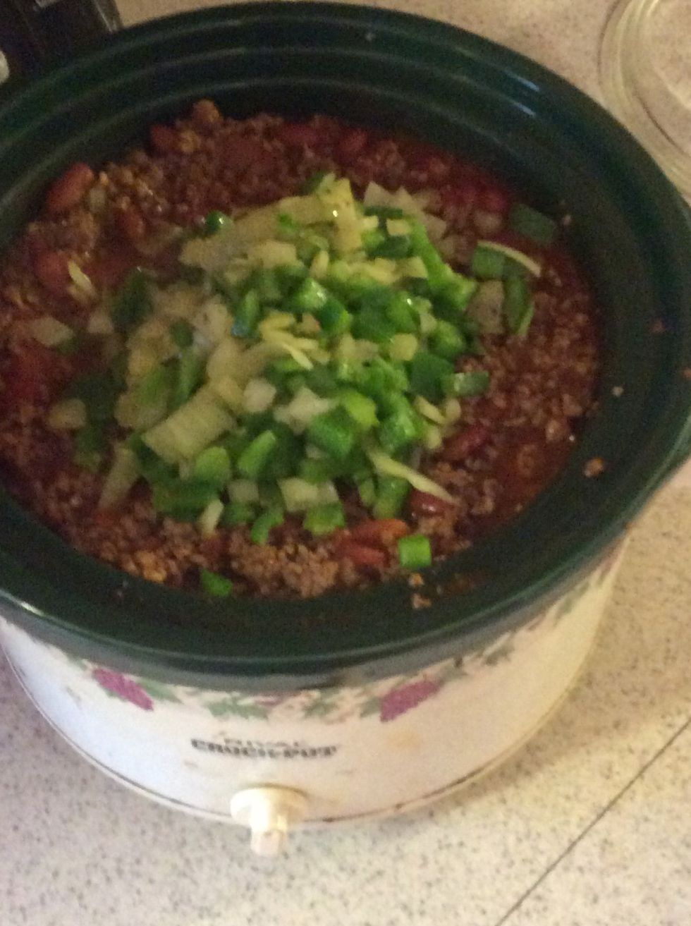 Add the peppers and onions into the crockpot