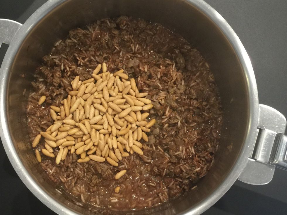 Add the pine seeds. Cover and cook until rice is al dente