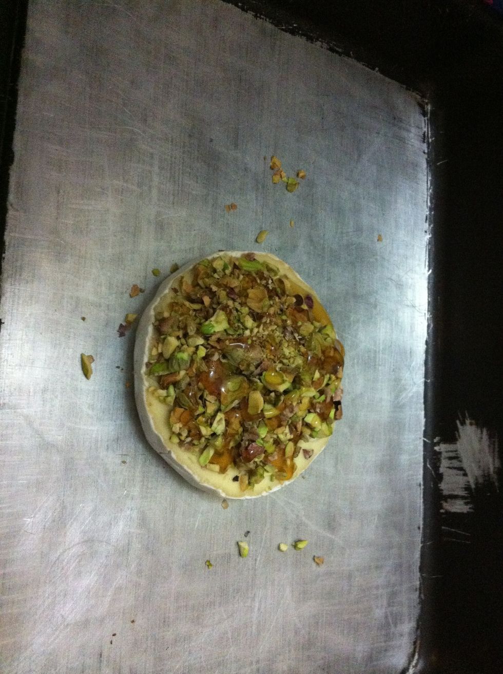 Add the pistachio... And more honey... Honey is like the glue and it will keep the pistachio together