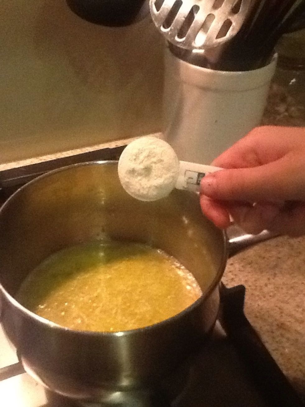 Add the plain flour to the melted butter. Stir for 1 minute over low heat