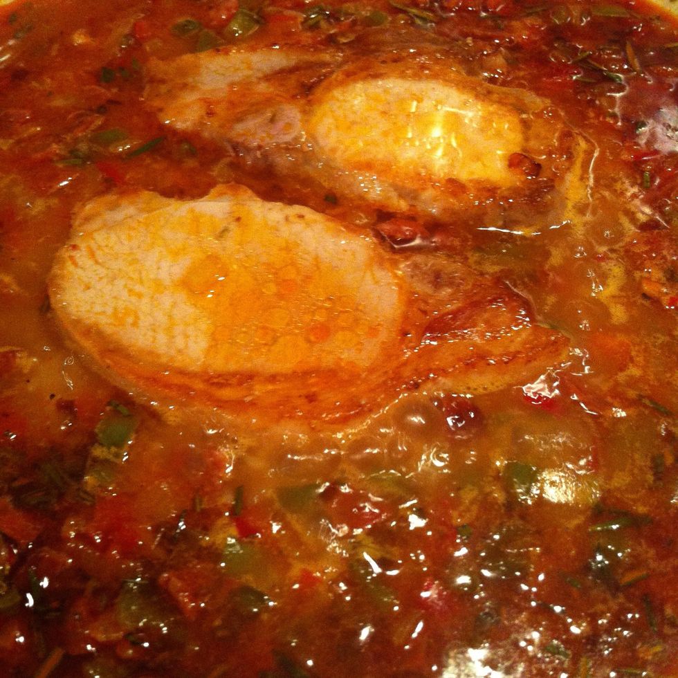 Add the pork back into the pan, just nestle it on top of the rice.