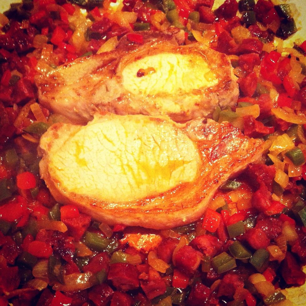 Add the pork to the pan and brown both sides. Then remove the pork and set aside. Now add the spices and the rosemary to the pan and stir in well.