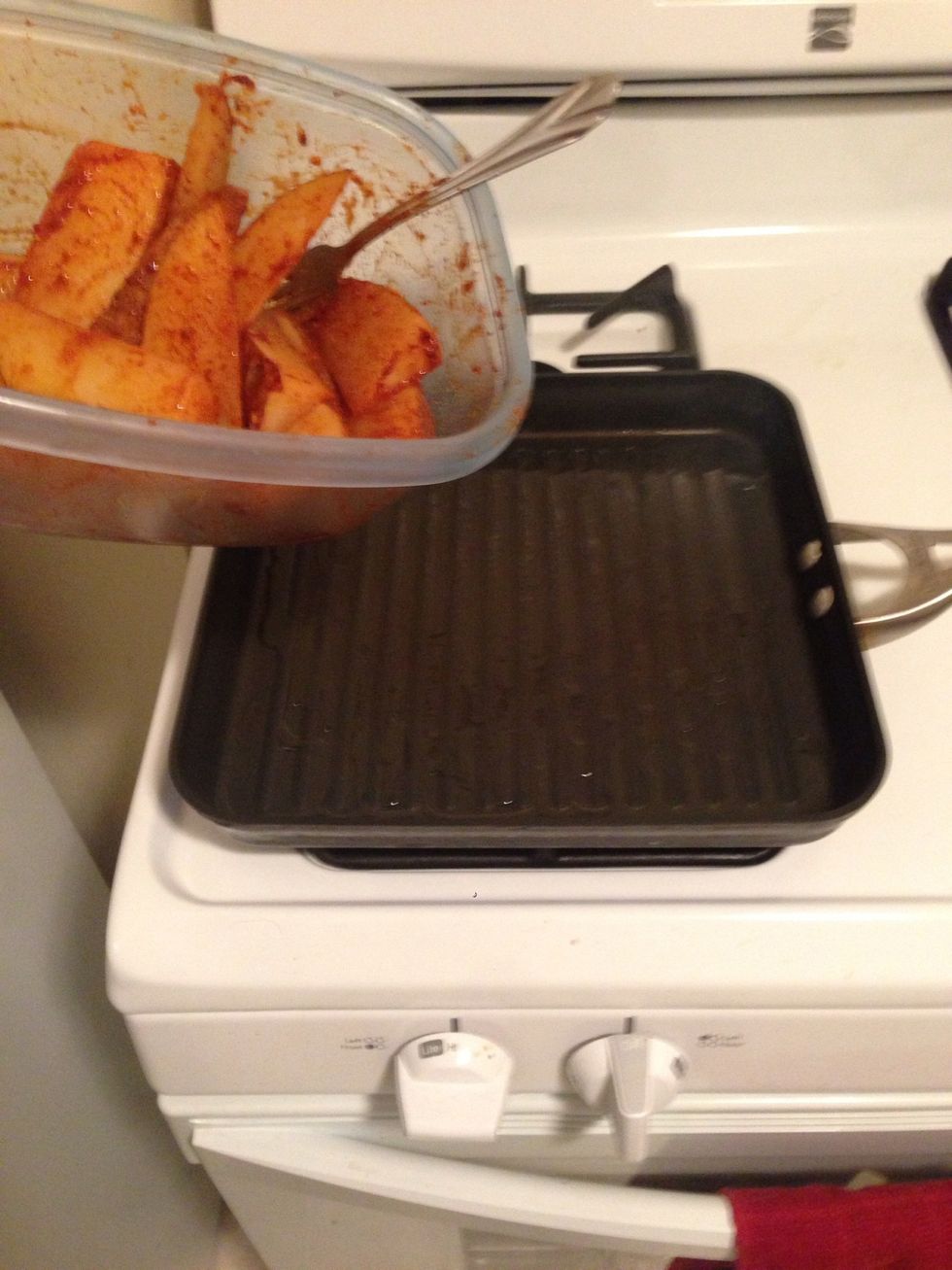Add the potatoes to the hot oil.