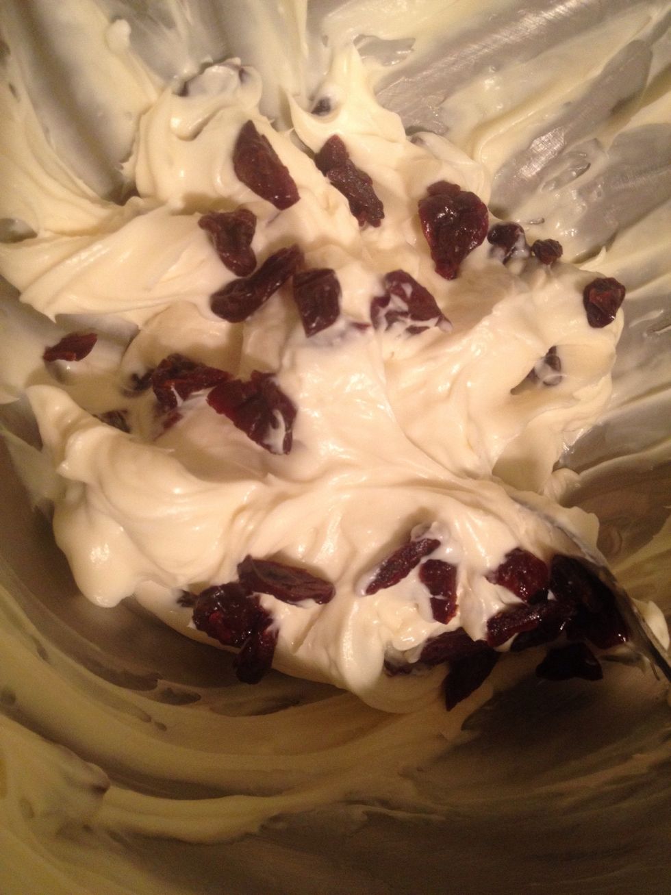 Add the powdered sugar, mix it in then add the vanilla extract. Put half if the mix in a separate bowl, then add the cherries to the remaining.