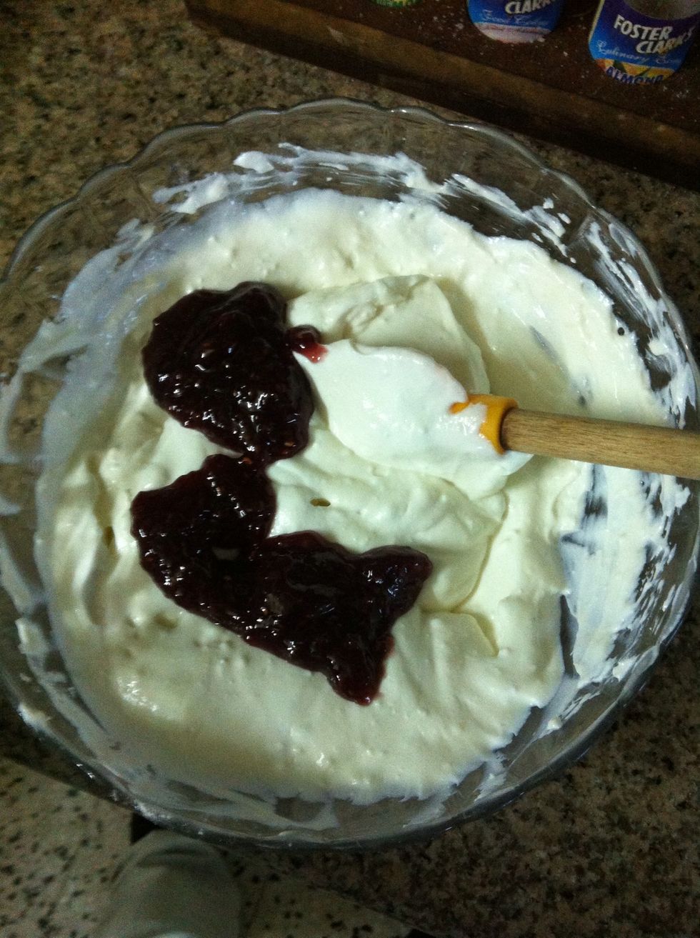 Add the preserve. I'm using a soft set raspberry preserve.