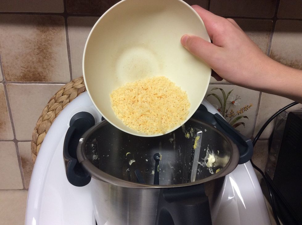 Add the previously grated parmesan cheese. Put lid back on