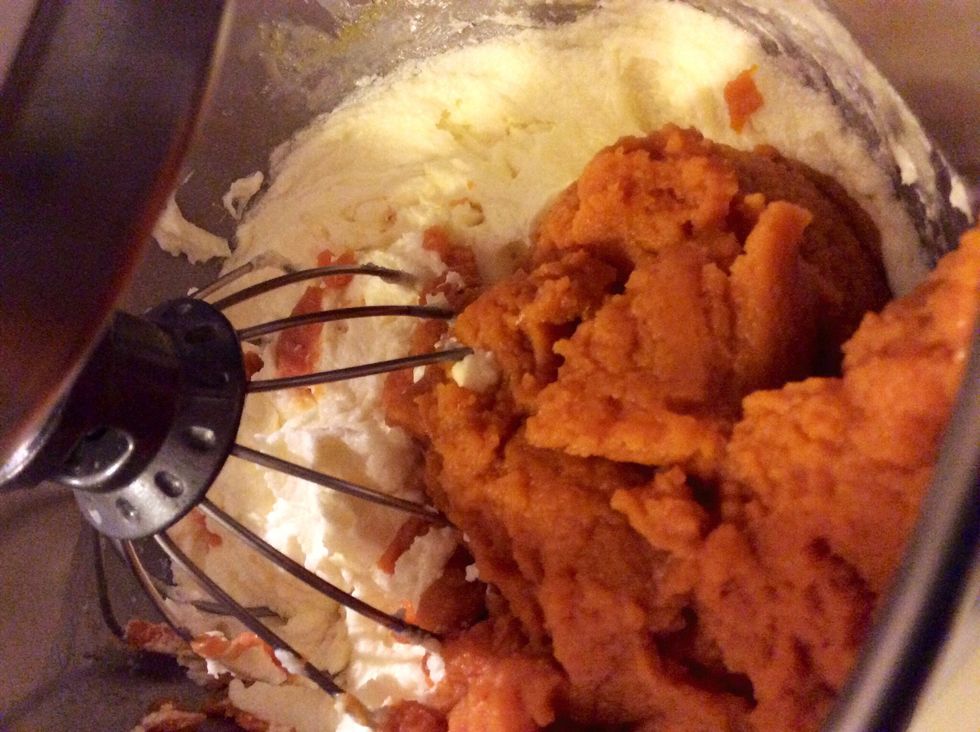 Add the pumpkin in after mixing the butter, sugar, and eggs well. Mix at medium speed until it looks fluffy.