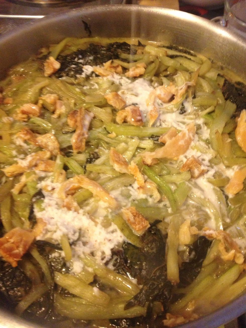 add the pure coconut creme and dried fish without mixing