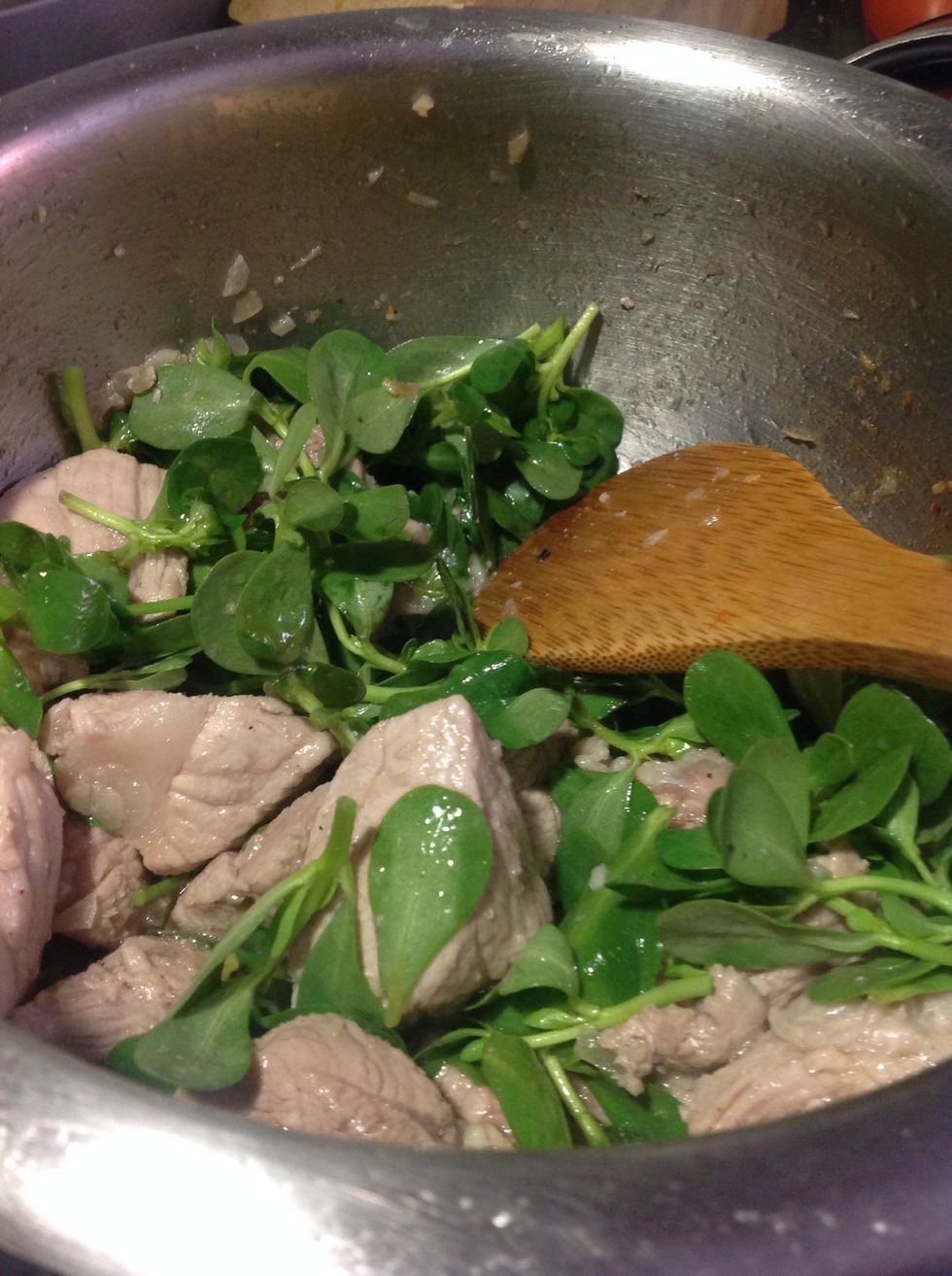 Add the purslane, they cook the same like spinach, season it whit salt and pepper