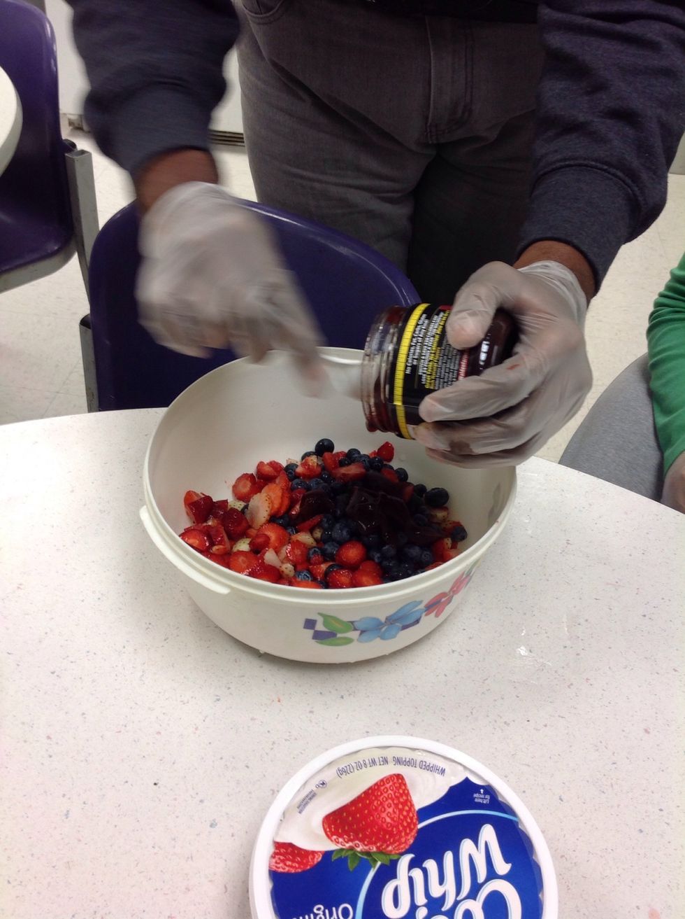 Add the raspberry spread with a spoon of water to loosen up the spread. It is very thick