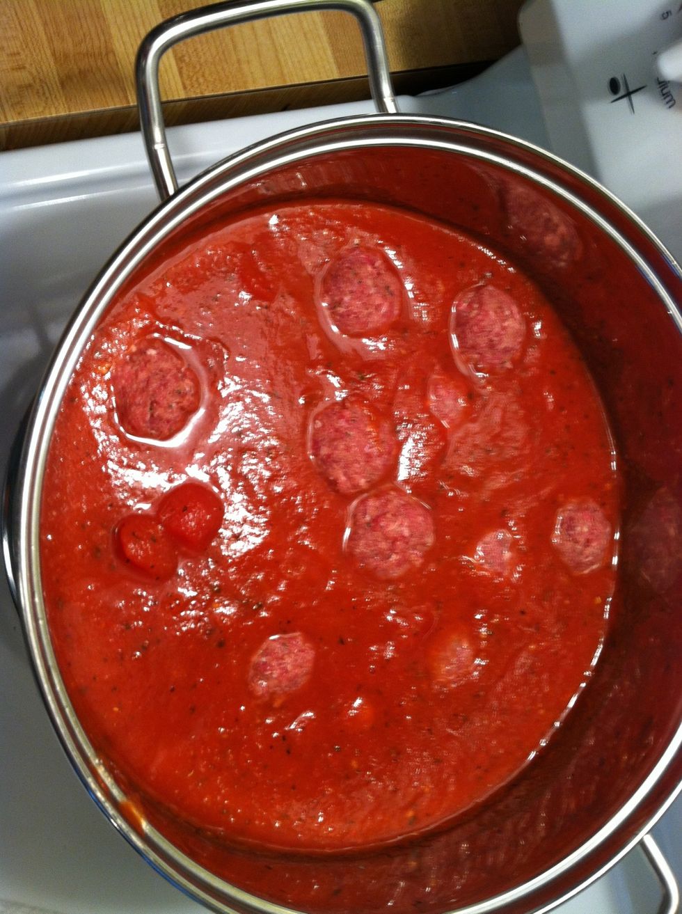Add the raw meatballs directly to the sauce and simmer away!!!
