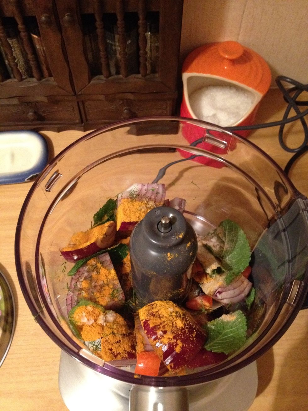 Add the red onion, turmeric, fennel seeds, ground cloves, red chilli and mint.