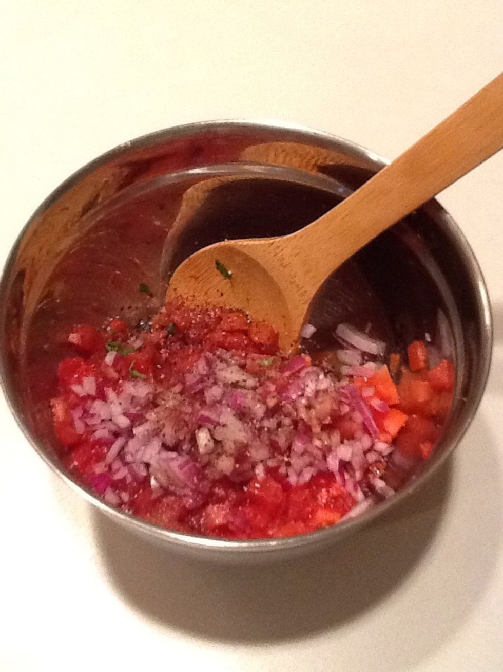 Add the red onions, balsamic vinegar, extra virgin olive oil, salt and pepper to your tomatoes. Mix well.