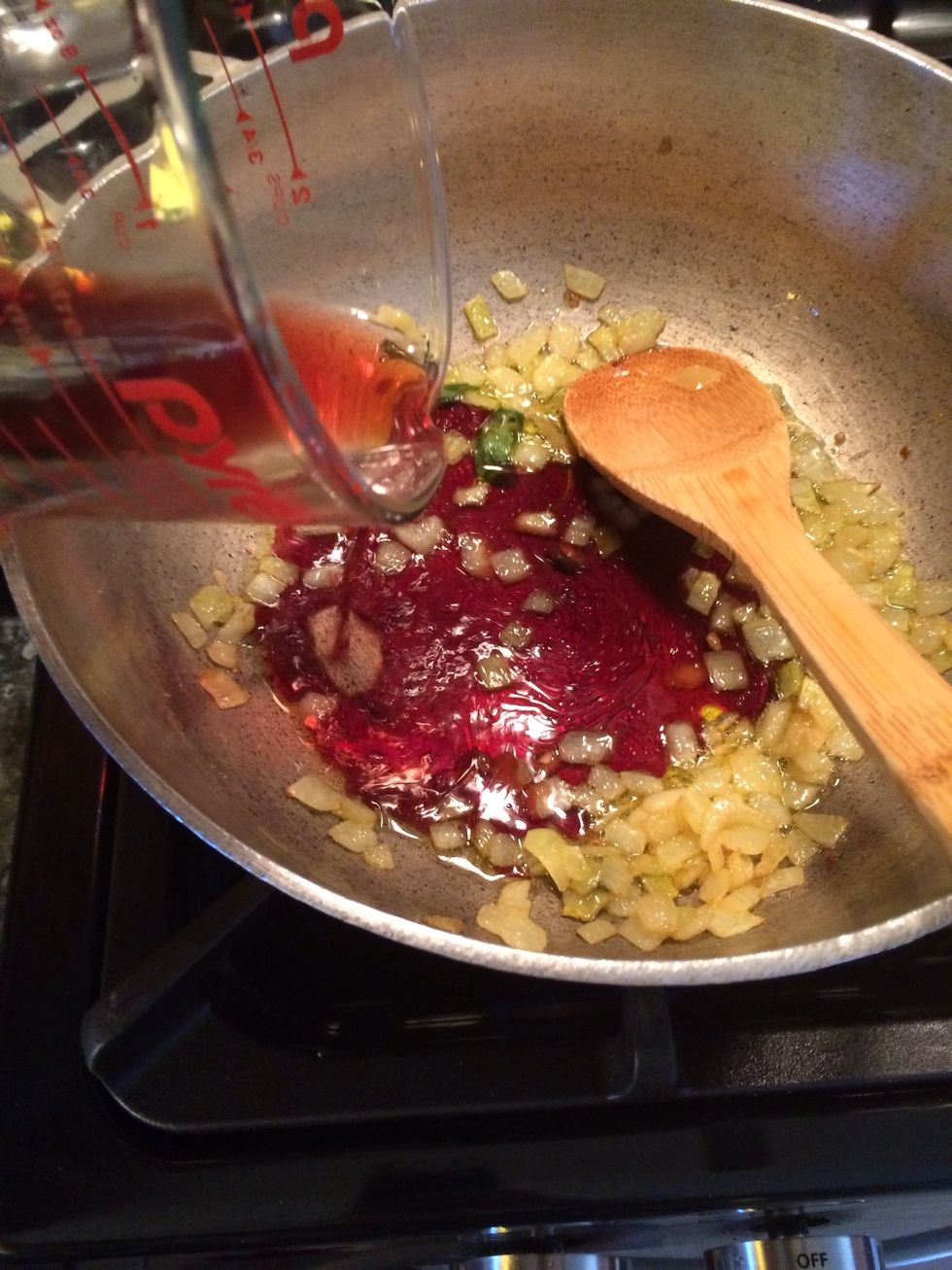Add the red wine and let it reduce to half of what you added to the pot. DO NOT USE the supermarket cooking wine, it is very salty. Buy a good red wine at you local liquor store.