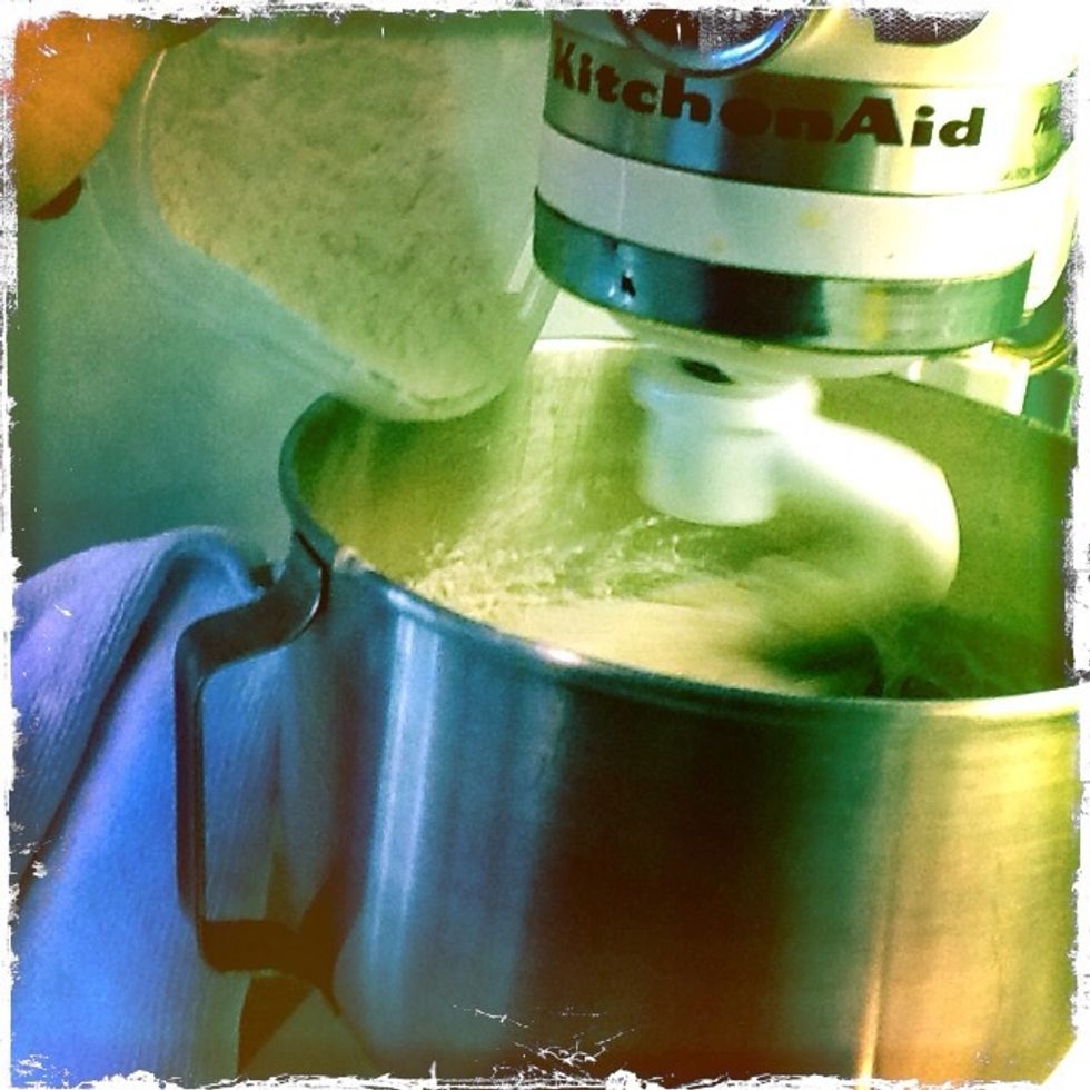 Add the remaining 150 grams of flour and mix slowly until the dough is...