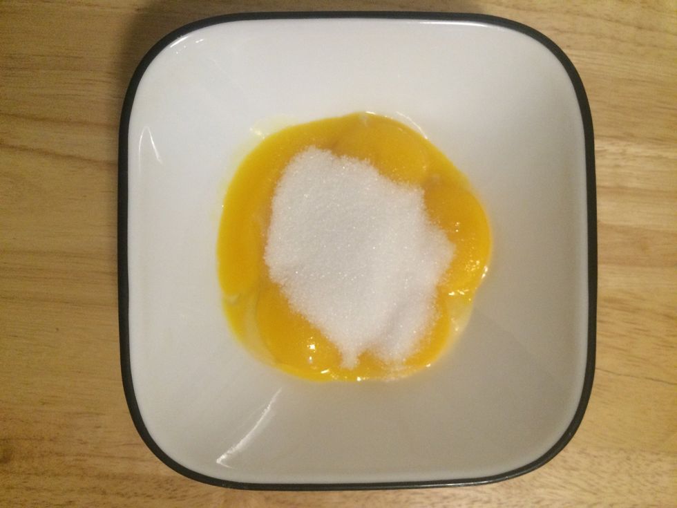 Add the remaining 3 tablespoons of sugar in your egg yolks and mix until a thickness forms.