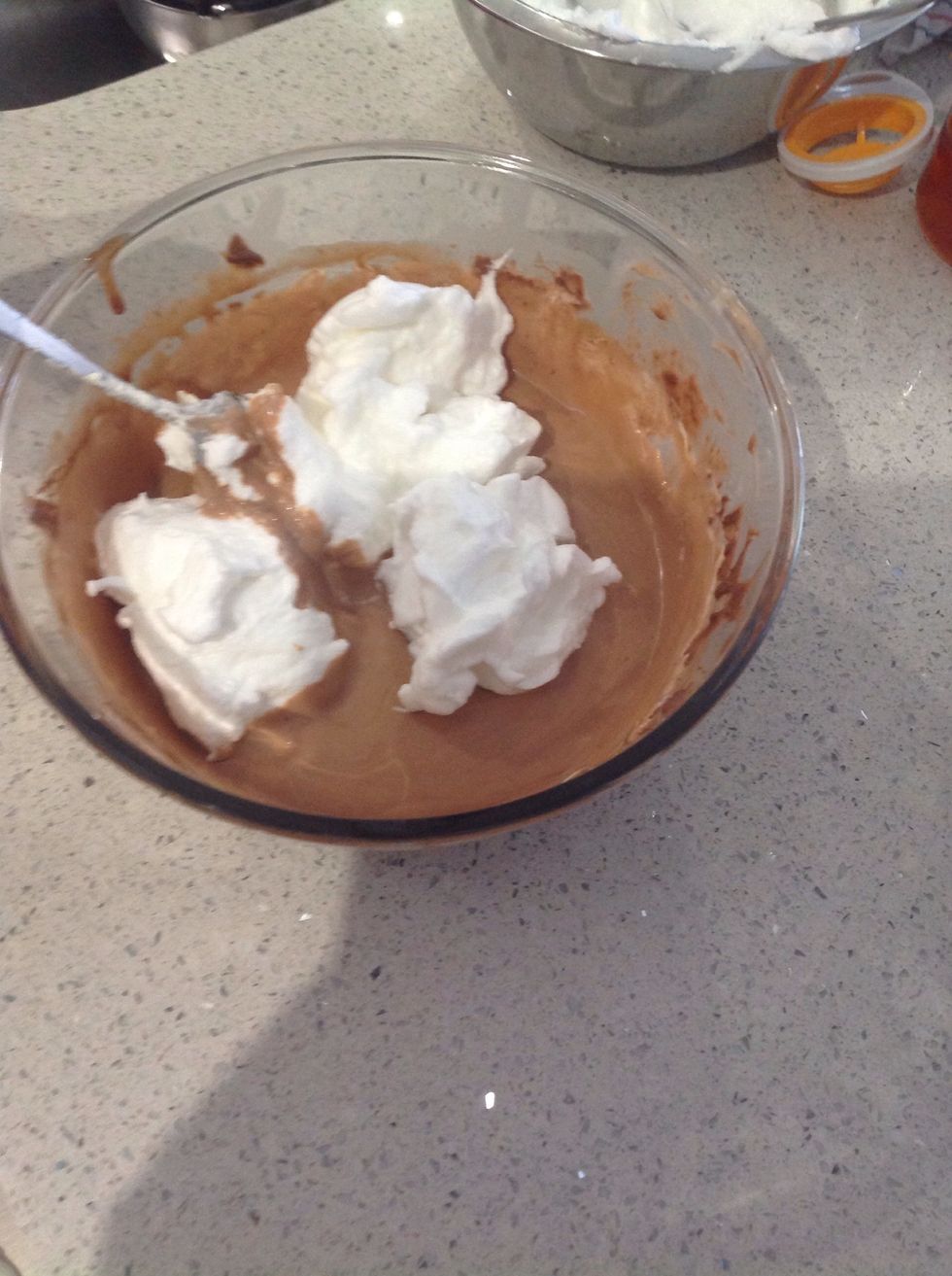 Add the remaining egg whites to the milk chocolate mixture and, once again, stir lightly until combined.