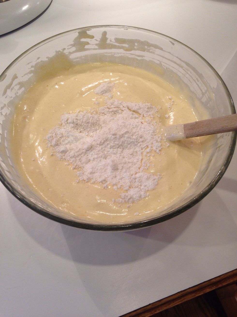 Add the remaining half of the flour and fold again.