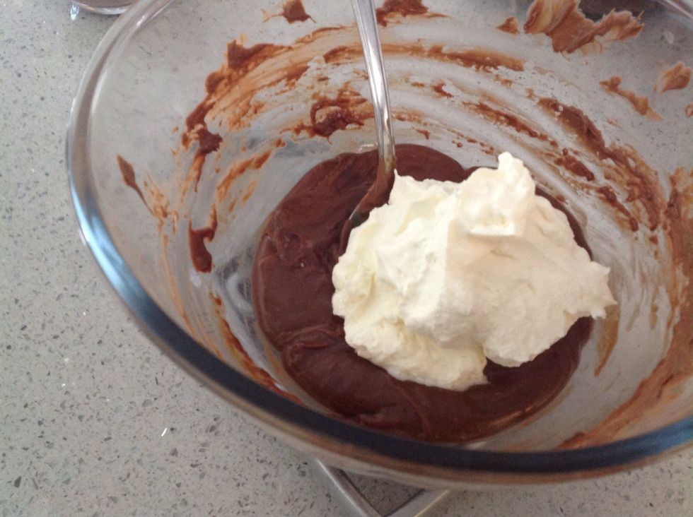 Add the remaining half of the thickened cream to the milk chocolate mixture and stir until well combined.