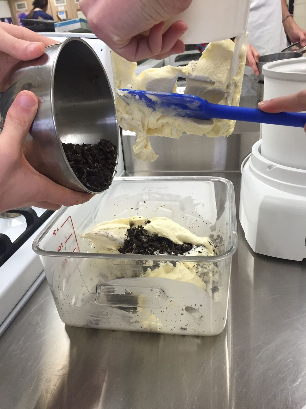 Add the remaining ice cream and oreo pieces to the container.