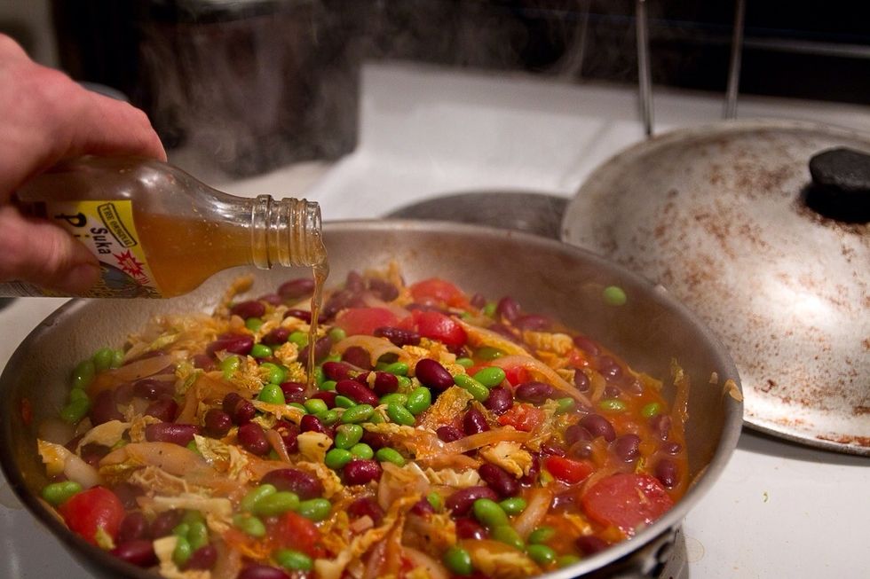 Add the remaining liquids and beans. There should only be the broccoli and peas left at this point. Bring this to a boil and then turn down to a simmer.