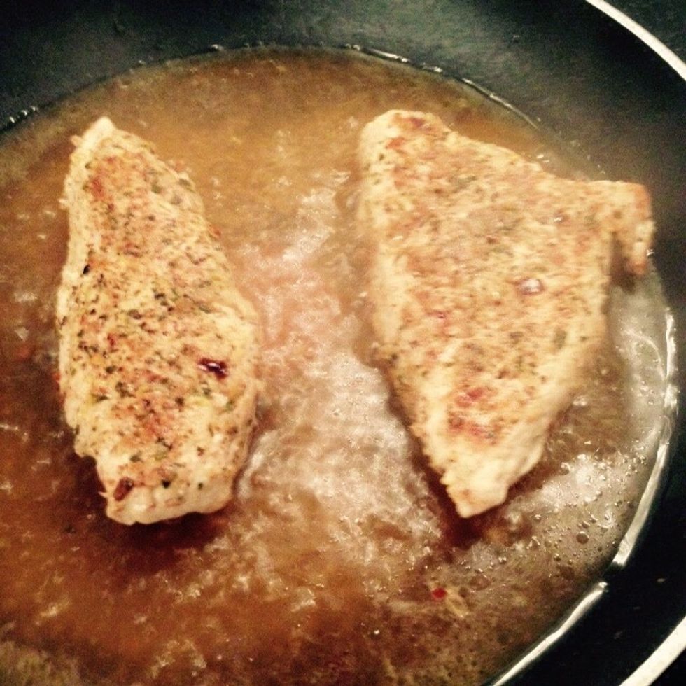 Add the remaining stock as well, cover with a lid and let cook for 10min, flipping the fillets after 5min to allow to cook evenly. Add some salt and pepper on each  side