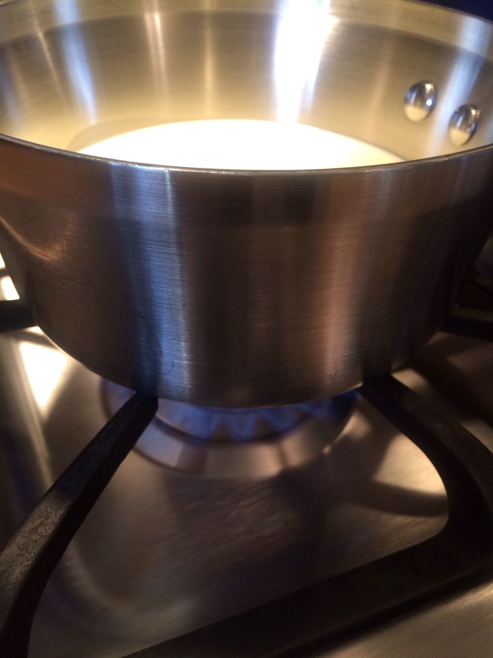 Add the remaining sugar to the cream and heat. Stir occasionally to dissolve the sugar.