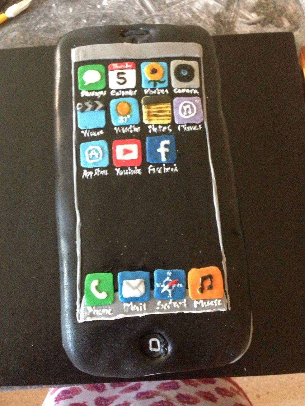 Add the rest of the details in fondant using your template to cut out the pieces by size. Tip: At the end, steam the cake to get rid of any icing sugar and to get a glossy finish.