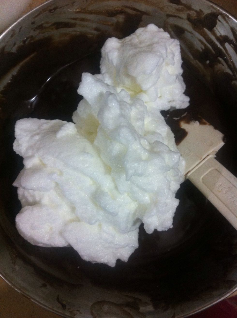Add the rest of the egg whites. Fold in again. Do NOT over mix or fold in too fast. Else the mousse won't be fluffy n light