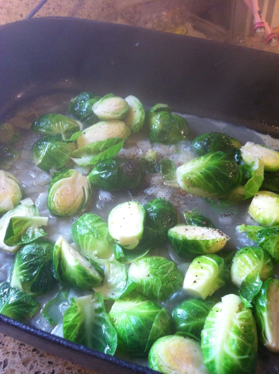 Add the rest of the half a cup water and let it boil. Once you see your sprouts green add half of your bacon. Let it boil for 5 min. You are done after 10 min. If you like it crispy.