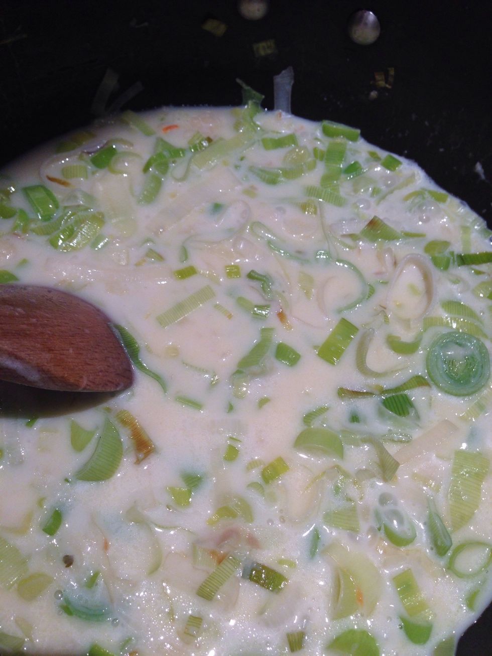Add the rest of the milk and the chicken stock. Simmer for two minutes