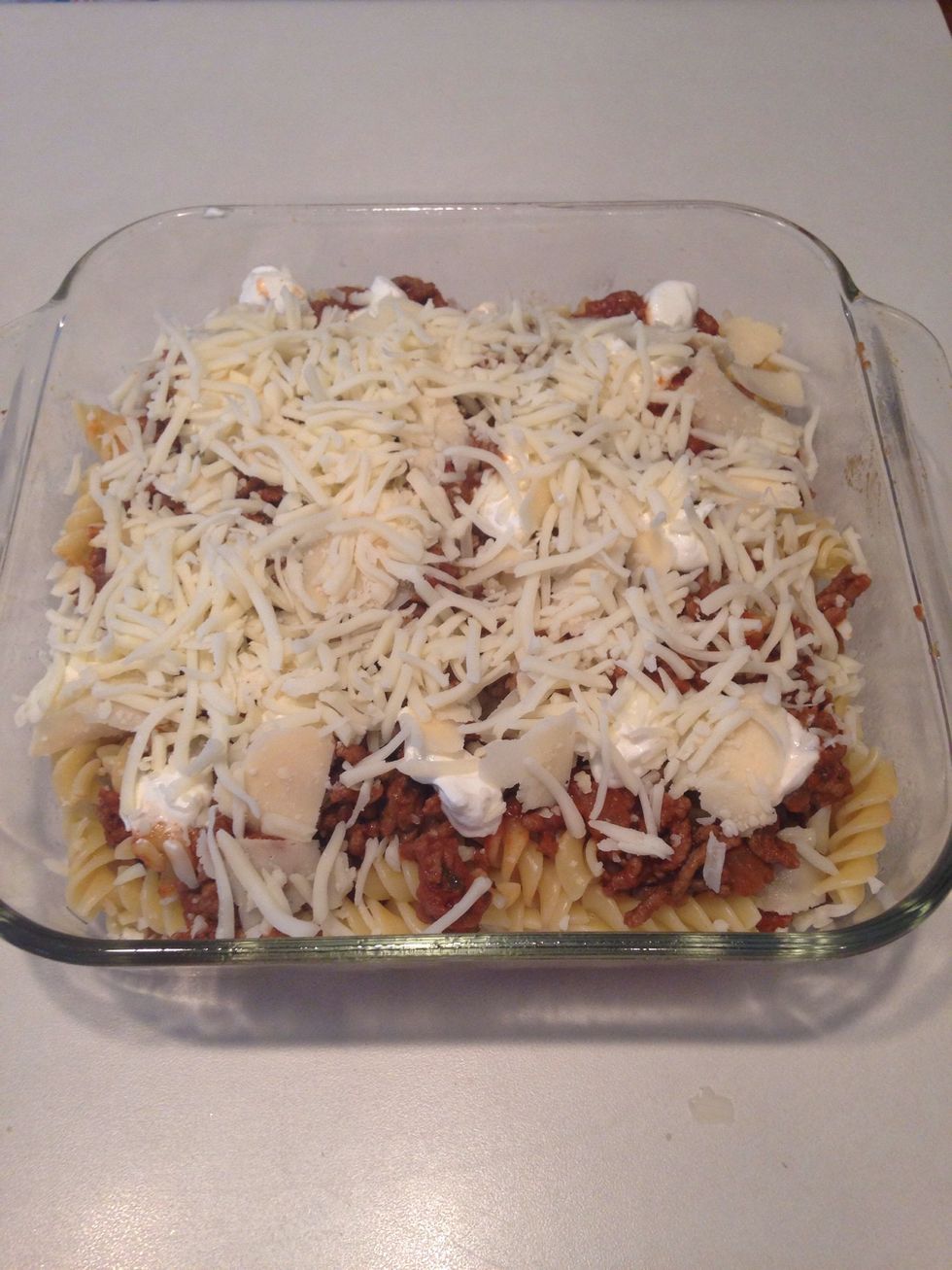 Add the rest of the Parmesan and mozzarella cheeses.