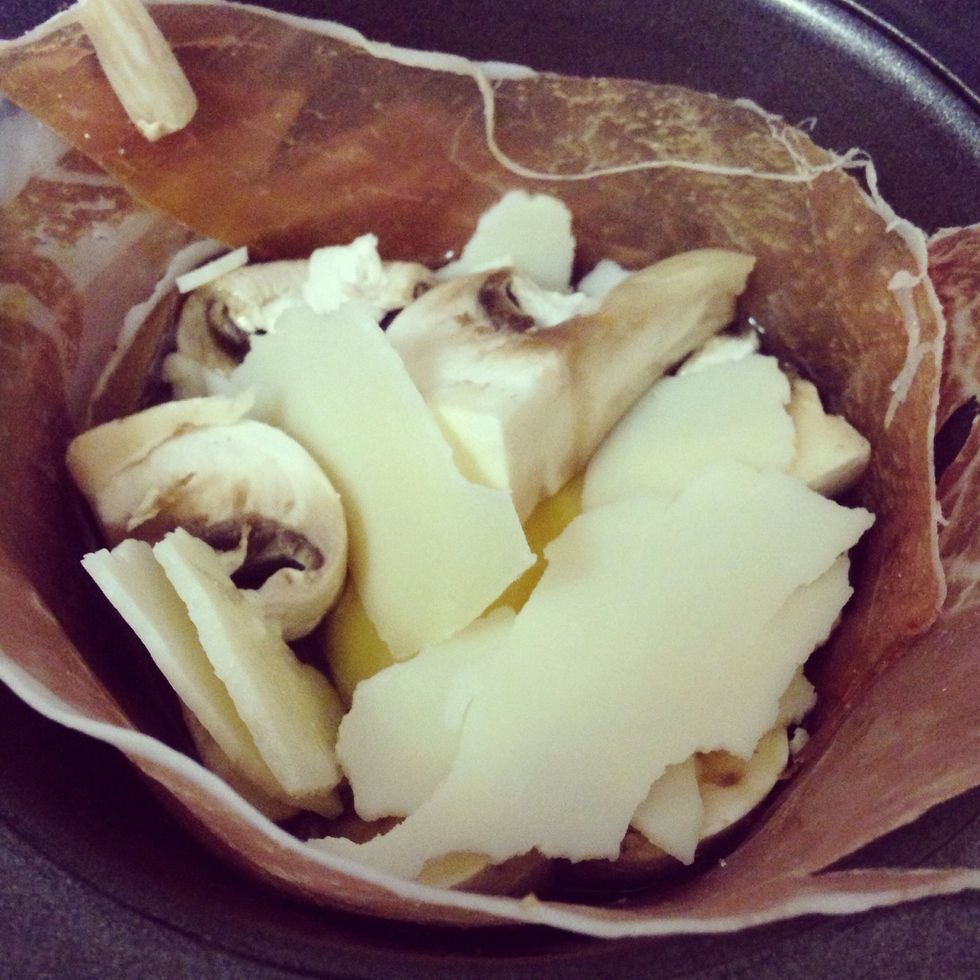 Add the rest of your ingredients: mushrooms, peppers, potatoes and cheese. Be sure to add seasoning salt to potatoes for flavour.