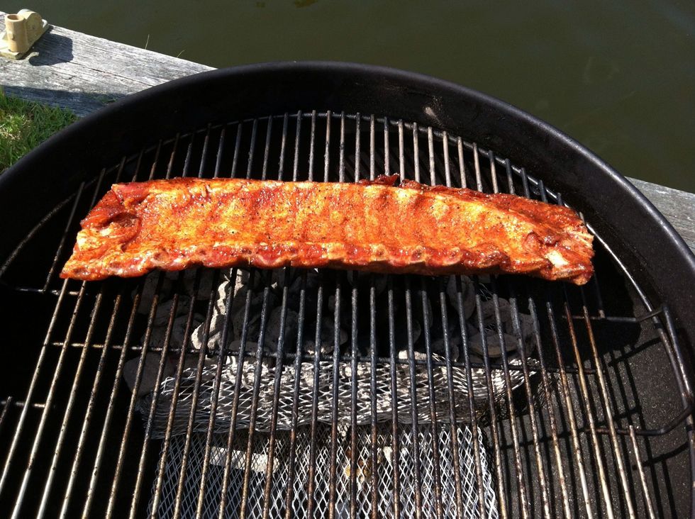 Add the ribs directly over the coals with the meat side facing down and grill for 3 - 4 minutes.  If you have several racks, they will need to be done one at a time.
