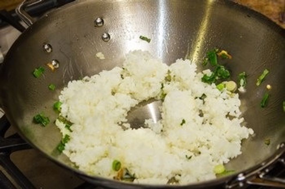 Add the rice and break the chunk of rice. Toss the wok (which is why you don\u2019t want to put too much rice) so the rice will fry out and mix well together.