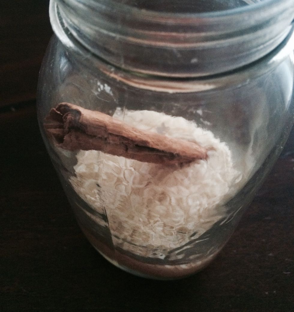 Add the rice and cinnamon stick into a jar or a bowl