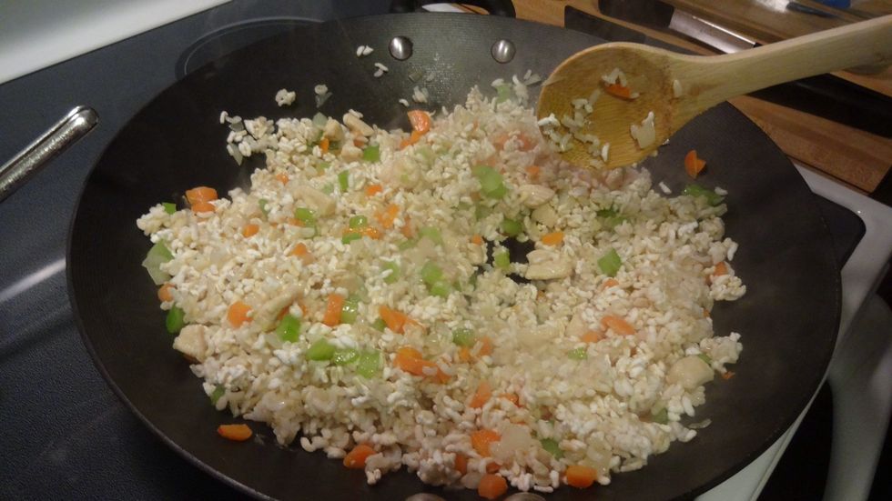 Add the rice. Continue cooking.