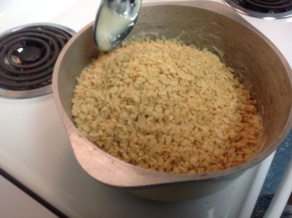 Add the Rice Krispies and stir let cool for a few minutes