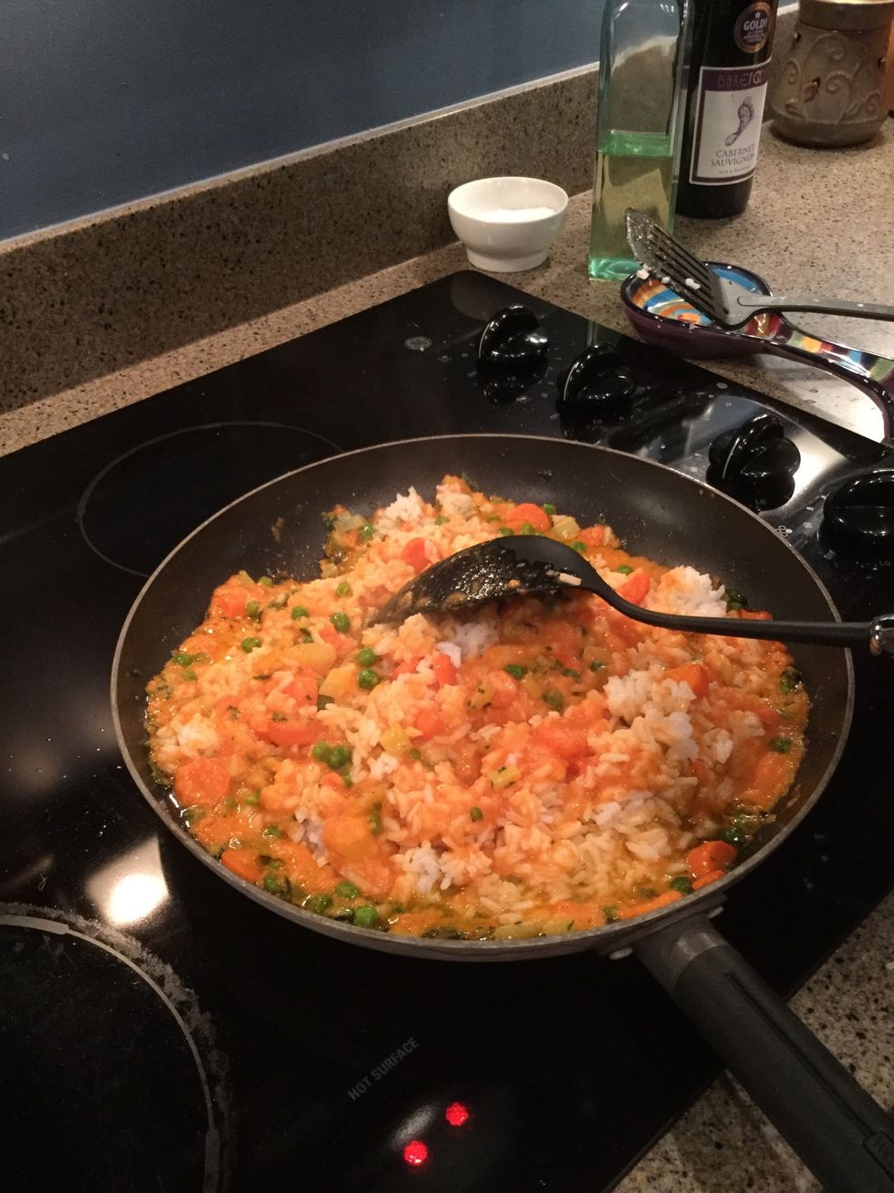 Add the rice, pureed vegetables, and sour cream to the vegetables in the skillet and mix well.