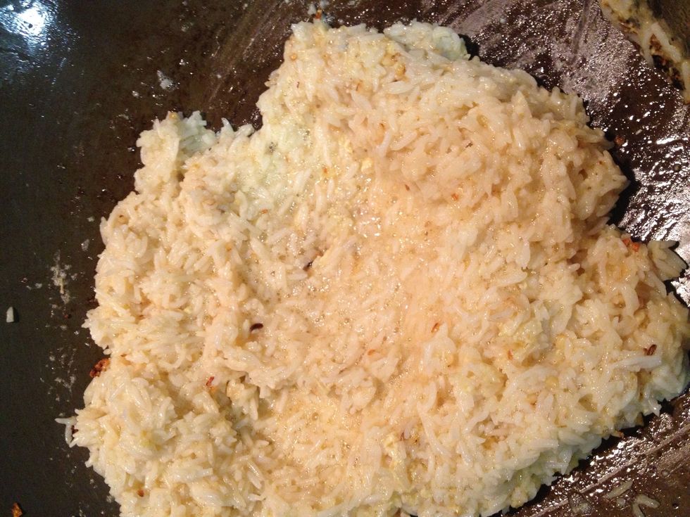 Add the rice that mixed with egg earlier and stir fried in high heat.