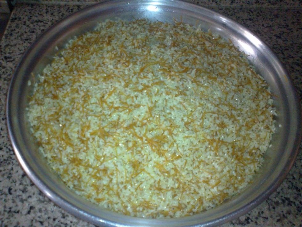 Add the rice to the pot ,filling it well and using the rice as the final layer