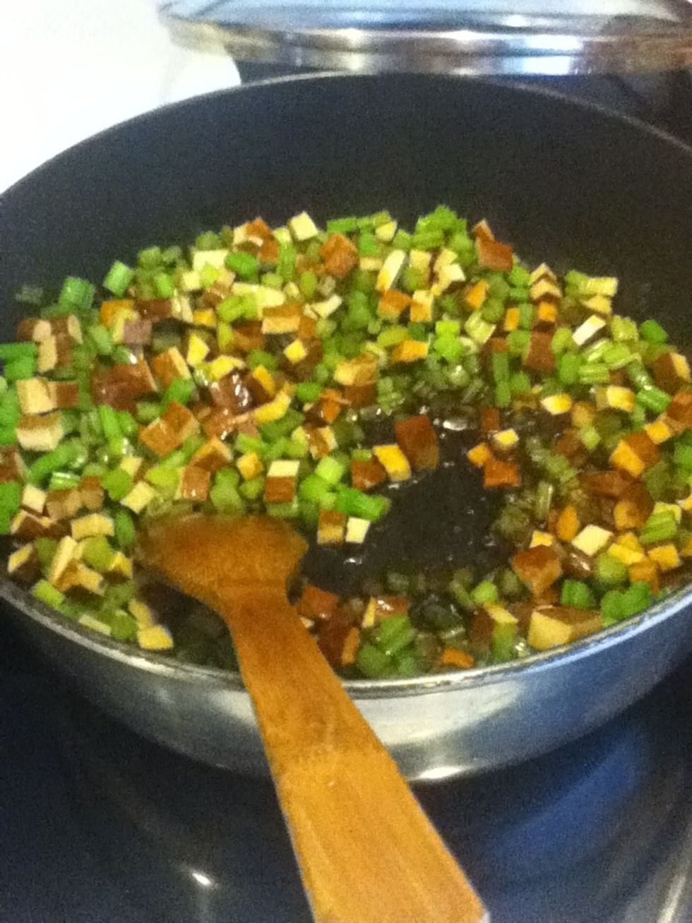 Add the rice wine and the sesame oil, and give your dish a stir.  Your meal is ready when the sesame oil becomes fragrant (only after a few seconds of cooking, usually).