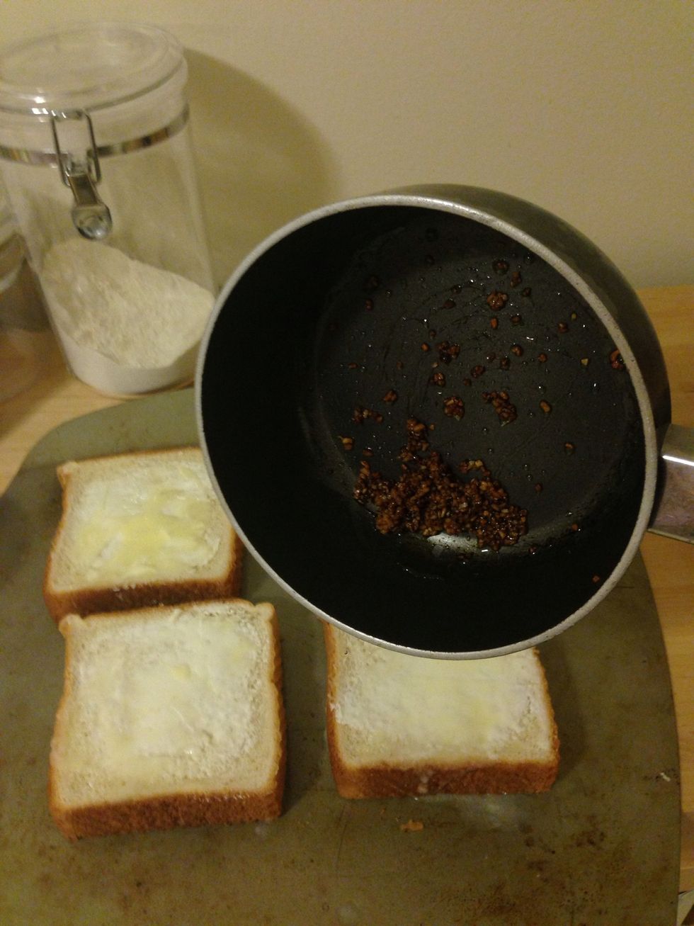 Add the roasted garlic to each slice.