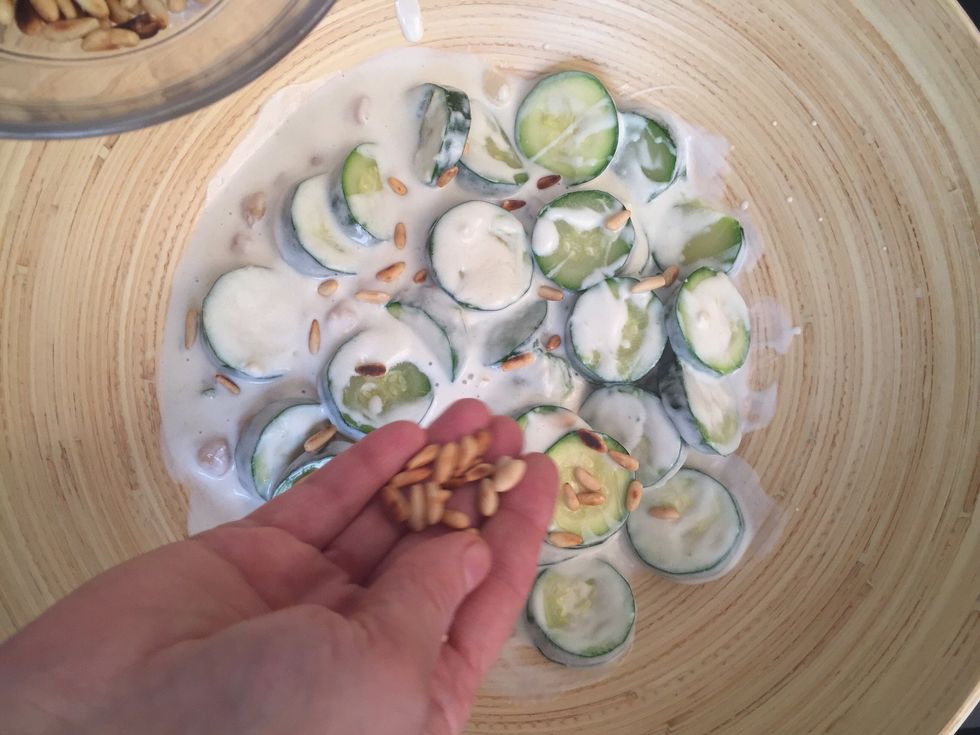 Add the roasted pine seeds