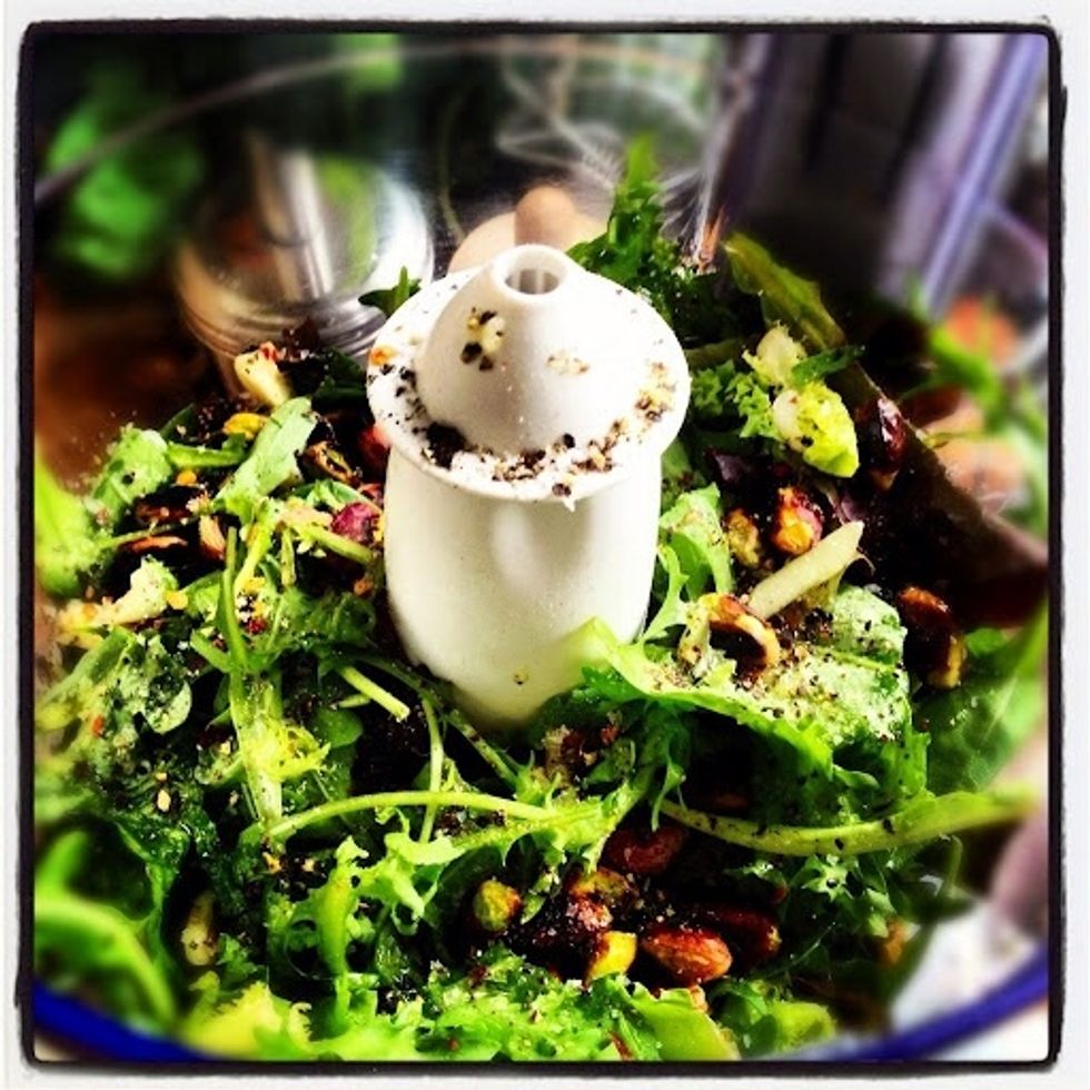 Add the Rocket/Arugula olive oil chilli flakes salt and pepper together with the toasted pistachios to a food processor. Pulse until a smooth pesto texture is achieved. It's tat quick and easy!