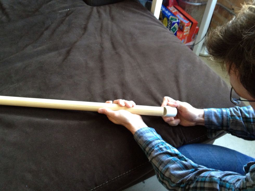 Add the rubber tip to the bottom of the dowel for traction.