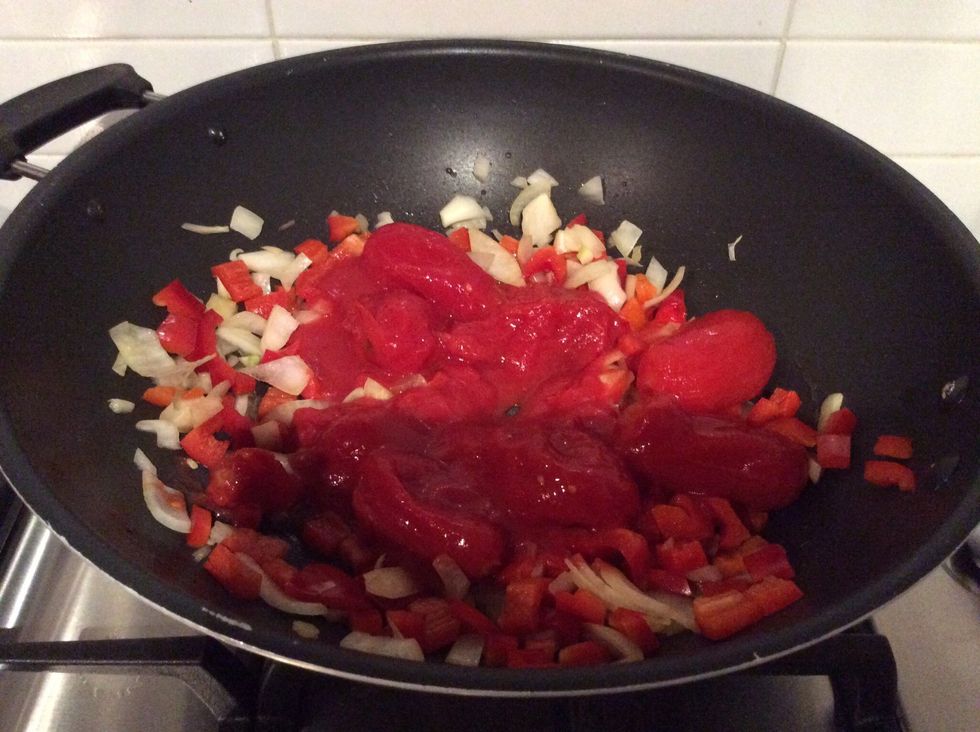 Add the sauce and tomatoes.