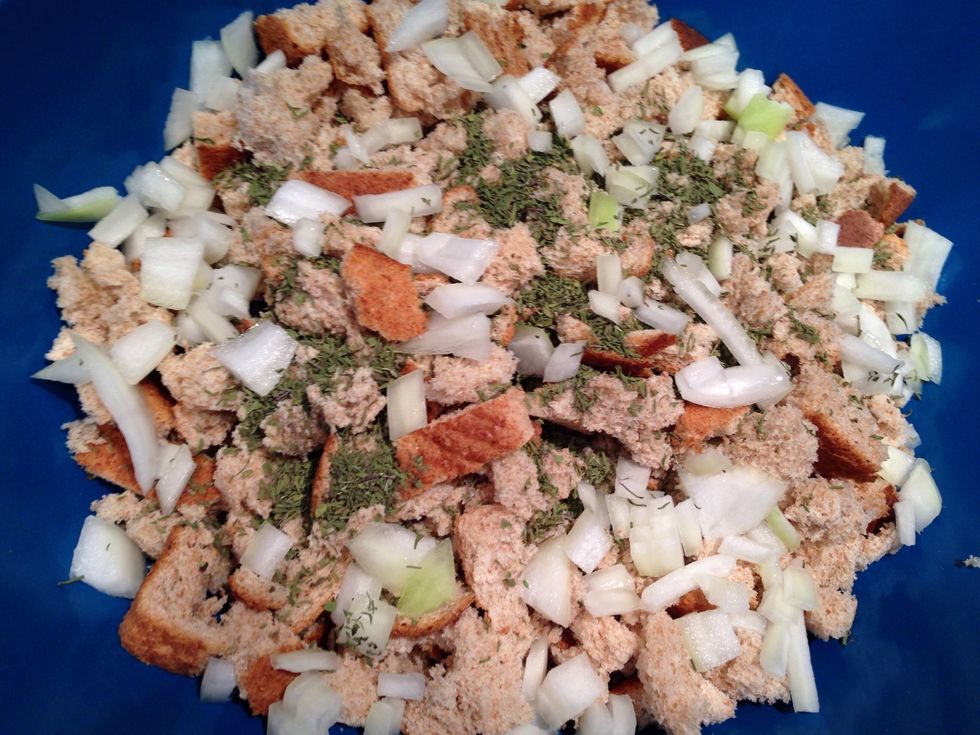 Add the savory and the onion to the pieces if bread and mix it together.